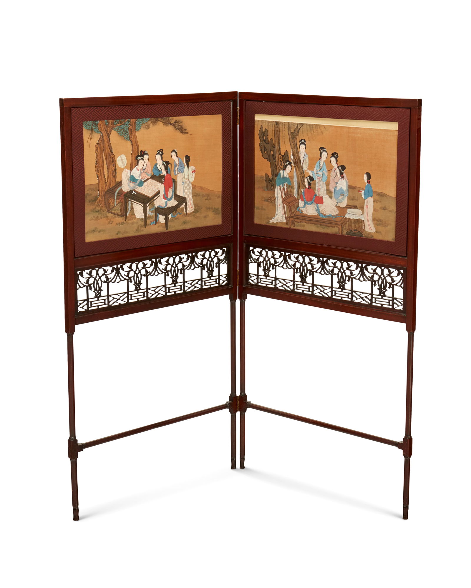 A George III mahogany two-panel fire-screen: A George III mahogany two-panel fire-screenCirca 1765In the manner of Thomas Chippendale (1718-1779), each panel with an inset Chinese painting on silk depicting women at leisure, over a pierced fret-