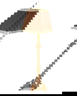 A Baroque-style carved giltwood floor lamp: A Baroque-style carved giltwood floor lamp20th centuryThe single-light lamp with candlestick-form standard raised on three legs with a tripartite base, surmounted by a paper shade, electrifiedOverall: