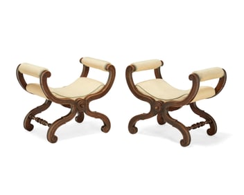 A pair of Baroque-style carved wood curule-form stools