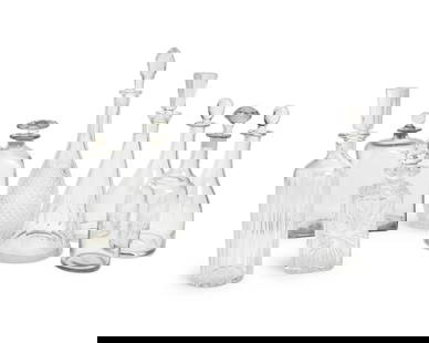 A group of clear glass decanters: A group of clear glass decantersOne with Baccarat stencil mark; two with stencil mark: DartingtonComprising a Baccarat ribbed cylindrical glass decanter, a pair of Dartington glass decanters, and six