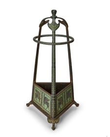 An Egyptian Revival fireplace tool stand