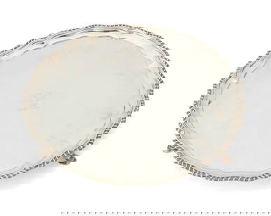 A Victorian sterling silver footed tray: A Victorian sterling silver footed tray1895Marked for sterling, for London, and with date mark; maker's mark: Carrington & Co.With a gadrooned and scalloped edge and a central engraved armorial of a s