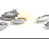 A group of silver-plated and metal serving vessels