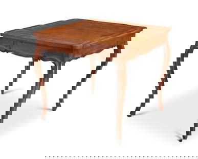 A Louis XV-style fruitwood games table: A Louis XV-style fruitwood games tableLate 19th/early 20th centuryThe square form top inset with a brown leather top with gilt-stamped border above two opposing drawers, raised on slender cabriole leg