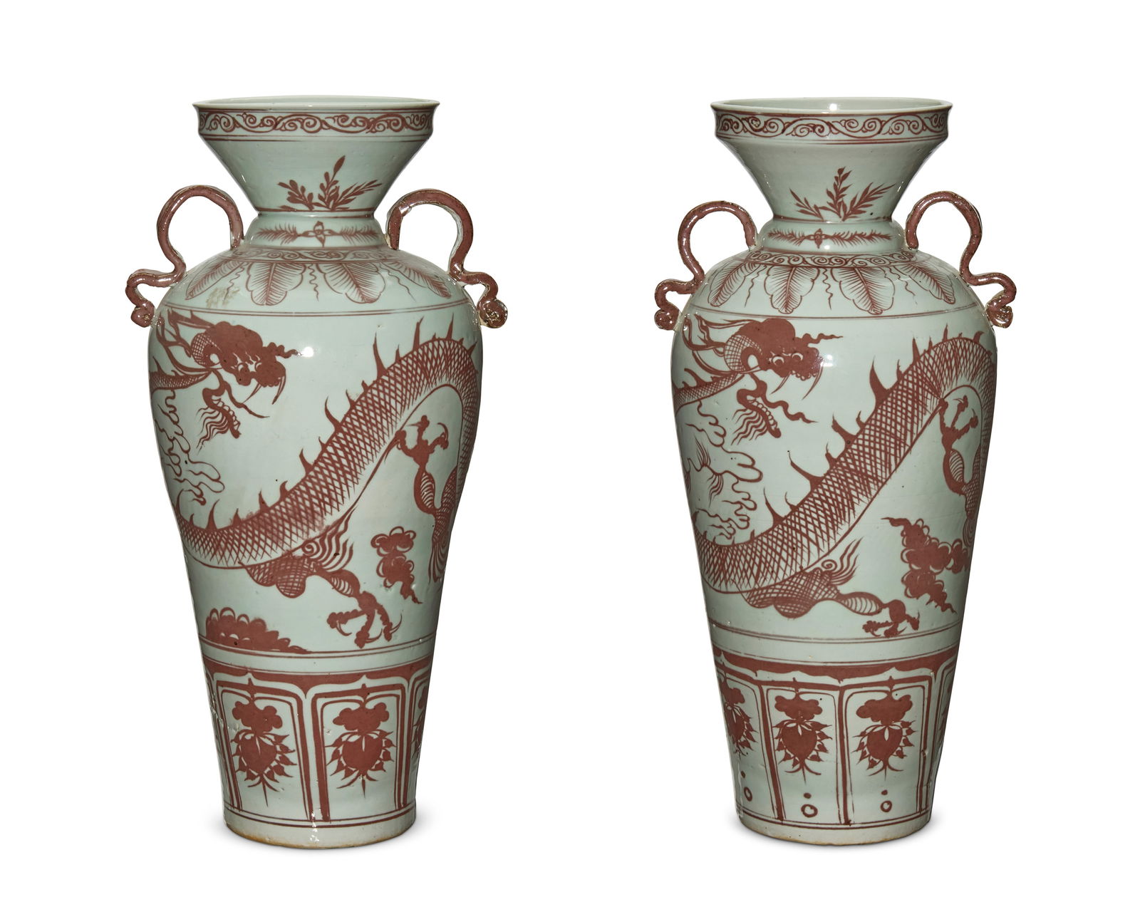 A pair of Chinese porcelain vases: A pair of Chinese porcelain vases20th centuryEach unmarkedEach with dragon-form opposed handles and red dragon motif decoration on white ground2 piecesEach: 18.5" H x 9.25" W x 8.5" D Provenance: