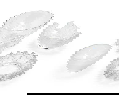 A group of Lalique glass table items: A group of Lalique glass table itemsLate 20th/early 21st century; FranceThree etched: Lalique trademarked France [post-1978]; one with block lettering factory mark and numbered: 16730Comprising a clea