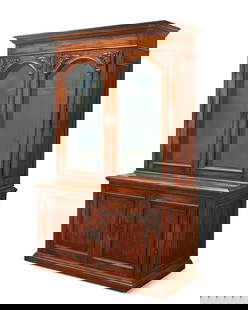 A Victorian-style stained wood gun cabinet: A Victorian-style stained wood gun cabinet20th centuryThe top with beveled glass doors, the interior converted to a space for nine guns behind locking glass inner doors, the base with two cupboard doo