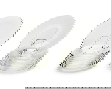 Two sets of Steuben clear glass plates: Two sets of Steuben clear glass platesLate 20th centuryEach etched: SteubenComprising a set of eight with a center well and a set of ten without18 piecesEach: 8.5" Dia. Provenance:From the Collec