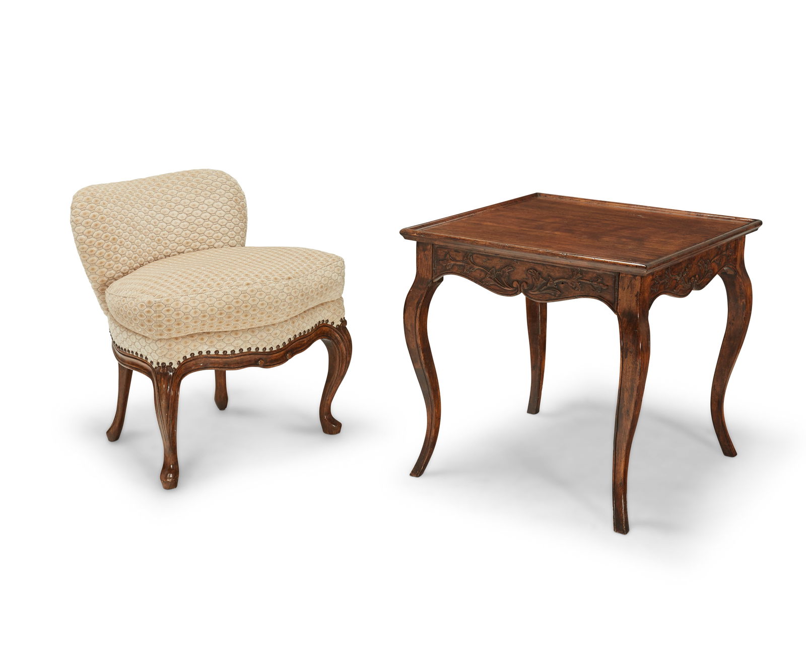 A Michael Taylor Designs "Frog" chair and a carved wood side table: A Michael Taylor Designs "Frog" boudoir chair and a carved wood side table20th centuryChair with Michael Taylor tag to undersideComprising a cream-upholstered boudoir chair with brass tacking and slip