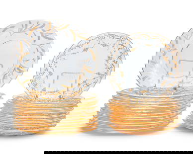 Two sets of gilt-heightened glass dessert plates: Two sets of gilt-heightened glass dessert platesLate 19th/early 20th centuryComprising a set of 12 plates with sheaves of wheat (8" Dia.), and a set of 17 plates with gilt vinery and swag decoration (