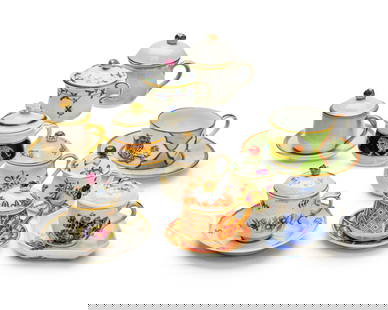 A collection of porcelain pot de creme cups: A collection of porcelain pot de creme cups20th/early 21st centuryVarious factory marksSome with saucers or lids, together with a set of four Lynn Chase porcelain 'Tiger Raj' teacups and saucers65 pie