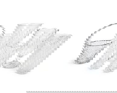 A group of cut glass vases: A group of cut glass vasesLate 20th/early 21st centuryTwo marked for WaterfordComprising two flared rim vases, two flared and scalloped rim vases, a footed vase with flared and scalloped rim, and a ba