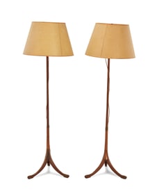 A pair of brass-mounted wood floor lamps