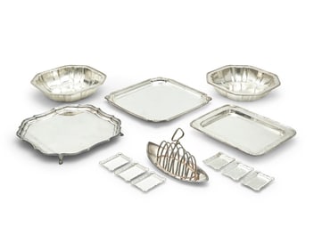 A group of silver-plated trays and serving vessels