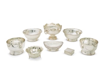 A group of silver-plated and metal bowls
