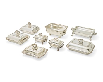 A large group of silver-plated entree and warming dishes