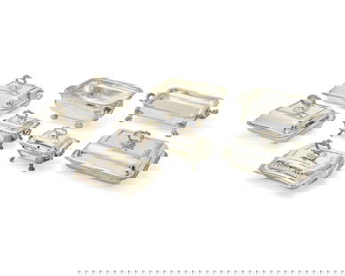 A large group of silver-plated entree and warming dishes: A large group of silver-plated entree and warming dishes19th/20th centurySome variously marked for makerComprising 12 entree dishes, all but one with cover, and 3 footed warming dishes15 piecesLargest