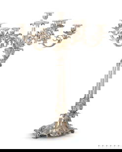 An English silver-plated candelabrum: An English silver-plated candelabrumEarly 20th centuryWith inscribed armorial: vigilate et orate; otherwise appears unmarkedLikely Sheffield, the seven-light candelabrum with foliate-cast nozzles and