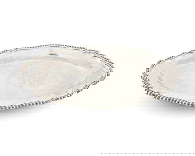 A Victorian sterling silver oval meat platter: A Victorian sterling silver oval meat platter1867With British hallmarks for sterling, London, date, Queen Victoria, and maker: RG [Robert Garrard); impressed: GARRARDS Panton Street LONDONThe oval pla