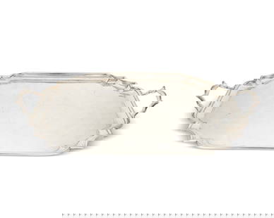 A George V sterling silver serving tray: A George V sterling silver serving tray1933With British hallmarks for sterling, London, date, and maker: S G [Garrard & Co.]The tray with beveled edge and opposed handles2.375" H x 27.5" W x 18" D129.