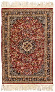 A Qom rug: A Qom rug20th centuryWool on silk foundation6' L x 4' 1.5" W