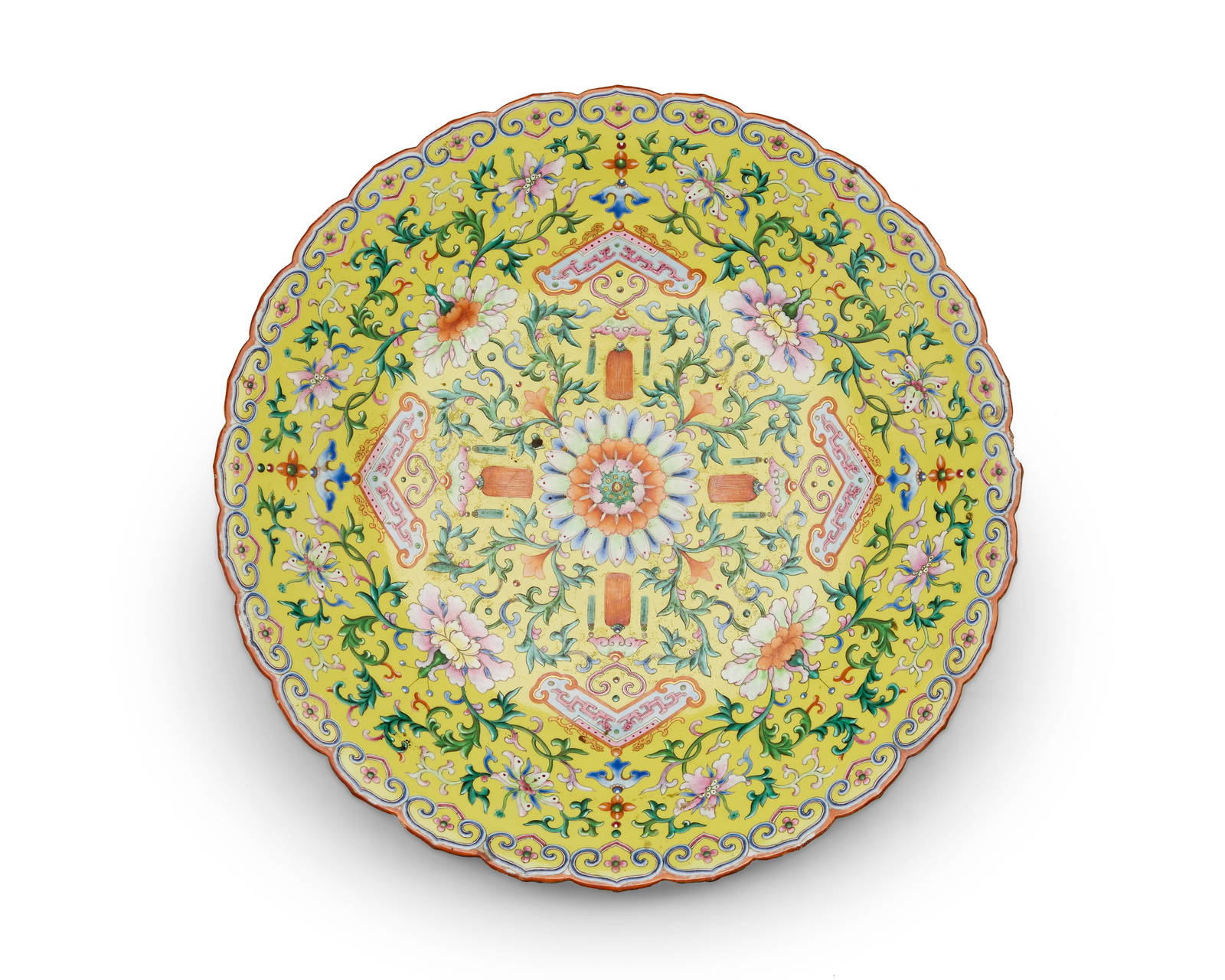A Chinese yellow ground Famille-Rose peony foliated rim charger