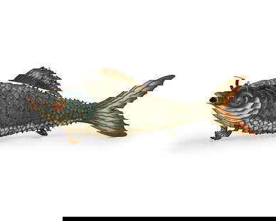 A Chinese enameled metal articulated fish: A Chinese enameled metal articulated fishEarly 20th centuryThe fish figure with articulated fins, whiskers, tail, and body in many segments4.25" H x 14.25" W x 2" D Provenance:From the Estate of Dorot