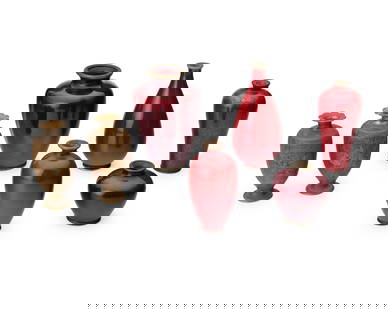 A group of East Asian diminutive bud vases: A group of East Asian diminutive bud vases20th centuryOne signed by Hayakawa Komejiro; others variously markedComprising five red enamel vases and two bronze vases, each depicting a village scene and