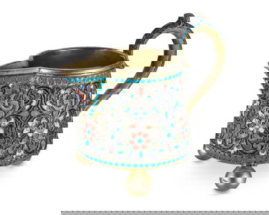 A Russian cloisonne and silver creamer: A Russian cloisonne and silver creamer1892With Russian hallmarks for Moscow, 84 zolotnik, and assay master Lez Fridrikhovitch OleksThe creamer with scrolled handle raised on three ball feet, featuring