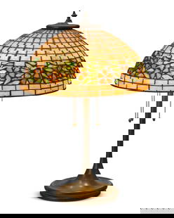 A Unique Art Glass & Metal Company cherry blossom table lamp: A Unique Art Glass & Metal Company cherry blossom table lampEarly-20th centuryUnmarkedThe patinated metal three-light lamp with dished base, surmounted by a leaded glass shade with floral band, electr