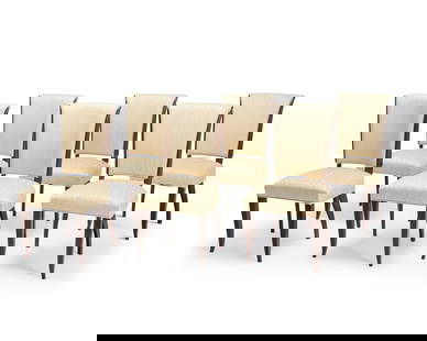 A set of Art Deco style dining chairs: A set of Art Deco style dining chairsLate 20th centuryEach appears unmarkedIn the manner of Jules Leleu (1883-1961), each side chair with a sloping back and curvilinear legs, upholstered in a cream fa