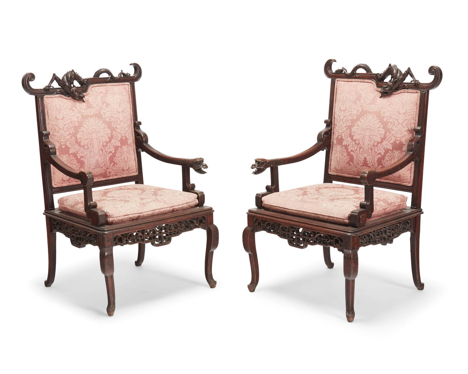 A pair of Chinese Export carved hardwood dragon armchairs