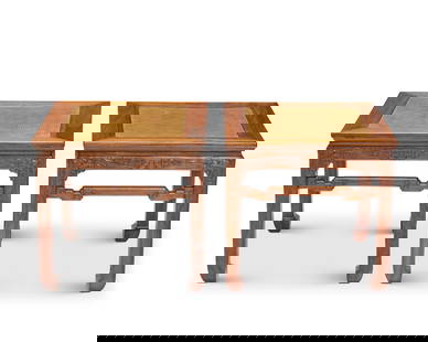 A pair of Chinese hardwood stools: A pair of Chinese hardwood stools20th centuryEach with caned top above an apron and high-set box stretcher carved with rolling clouds2 piecesEach: 20.5" H x 21.625" W x 21.625" D