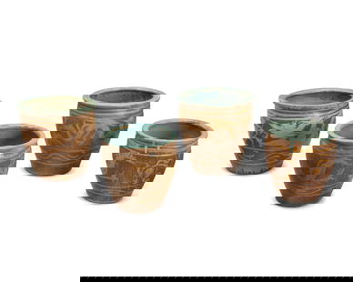 A group of Asian ceramic jardinieres: A group of Asian ceramic jardinieres19th century or later; China or Southeast AsiaEach ovoid jardiniere depicting a dragon figure in ochre and brown glazes, with a teal glazed interior4 piecesLargest: