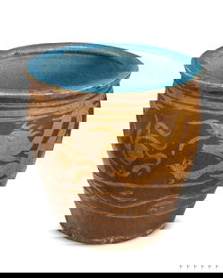 A large Asian ceramic jardiniere: A large Asian ceramic jardiniere19th century or later; China or Southeast AsiaThe large ovoid jardiniere depicting a dragon motif in ochre and brown glazes, with a blue glazed interior19.5" H x 20.5"