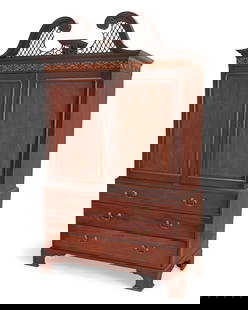 A George III Chippendale-style mahogany linen press: A George III Chippendale-style mahogany linen press19th century with later elementsThe broken swan neck and latticework pediment above denticulated trim and a band of fretwork, above two hinged lockin