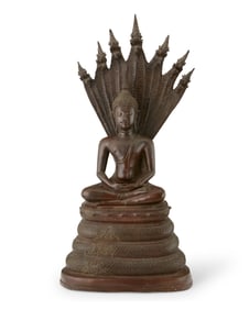 An Asian bronze Naga Buddha figure