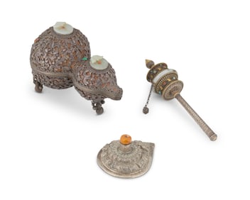 An assembled group of Vajrayana Buddhist implements with jade and silver elements