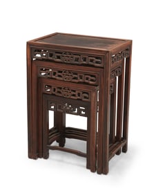 A set of four Chinese carved wood nesting tables