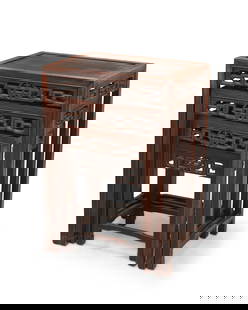 A set of four Chinese carved wood nesting tables: A set of four Chinese carved wood nesting tables20th centuryEach table with inset top above an openwork apron with central medallion, in graduated sizes4 piecesLargest: 28" H x 20" W x 14.25" D; Small