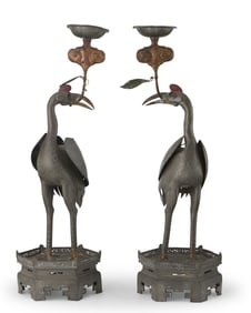 A pair of Chinese pewter crane candlesticks