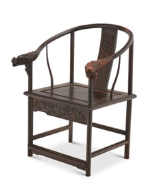 A Chinese carved hardwood horseshoe chair