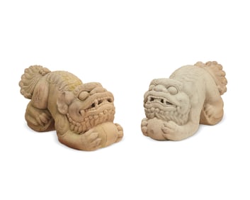 A pair of large carved stone Komainu statues