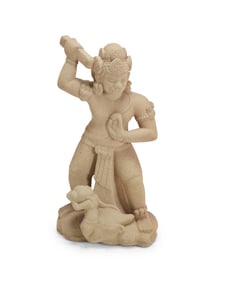 An Asian carved stone sculpture of a Dharmapala