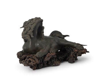A Japanese patinated bronze Shishi figure