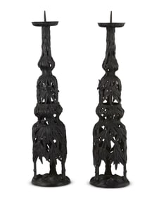 A pair of Japanese patinated bronze candlesticks