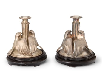 A pair of silver-plated figural candlesticks
