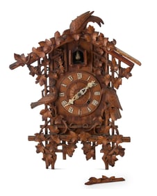 A Black Forest carved wood cuckoo clock
