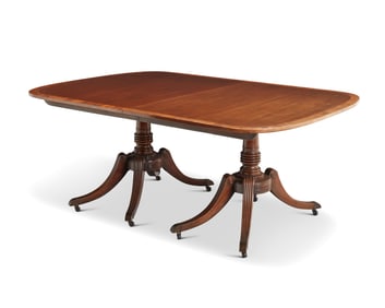 A Regency-style mahogany twin pedestal dining table