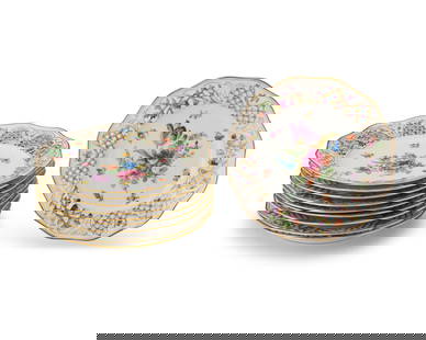 A set of ten Schumann porcelain 'Chateau Dresden' dinner plates: A set of ten Schumann porcelain 'Chateau Dresden' dinner platesEarly 20th century; GermanyEach marked to underside: Schumann / BavariaEach with reticulated rims and transfer-printed floral motifs10 pi